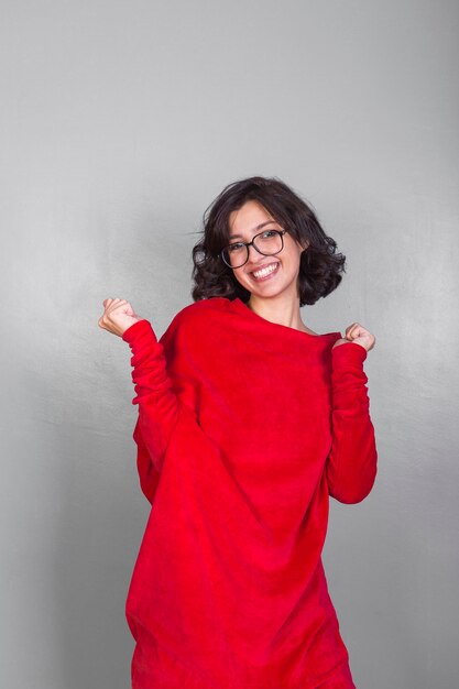 Joyful woman in red dress 