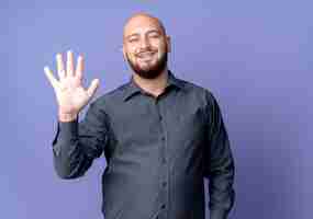 Free photo joyful young bald call center man showing five with hand isolated on purple