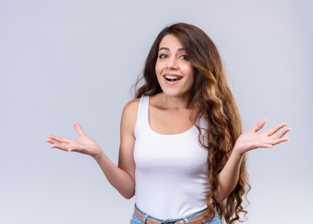 Joyful young beautiful girl showing empty hands 