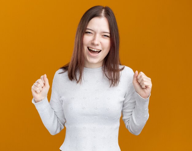 Joyful young pretty girl doing yes gesture 