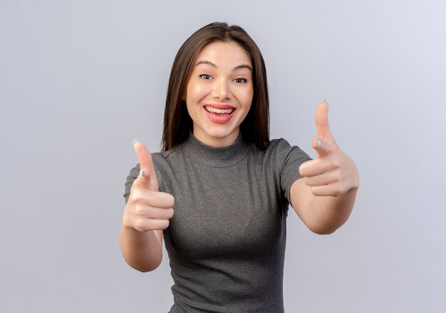 Joyful young pretty woman doing you gesture at camera isolated on white background with copy space