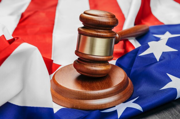 premium-photo-judge-gavel-on-the-flag-united-states-of-america