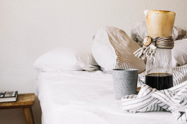 Jug with coffee and cup