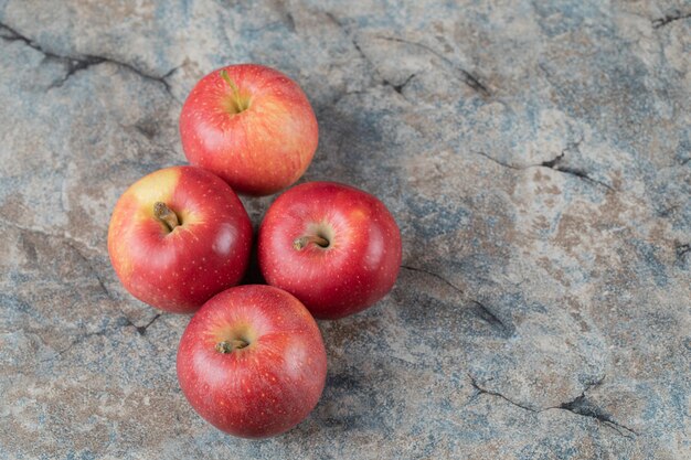Juicy apple isolated on concrete marble.