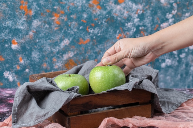 Juicy apples in a rustic wooden tray