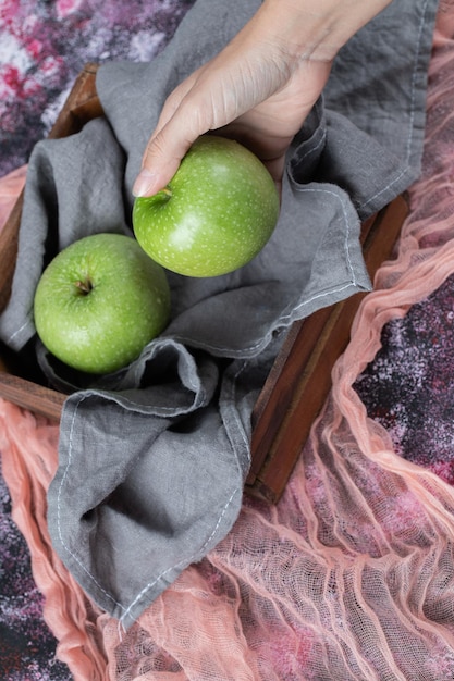 Free photo juicy fresh apples on wooden rustic tray.