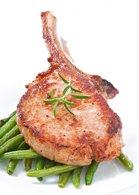 Juicy grilled pork fillet steak with green beans