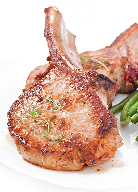 Juicy grilled pork fillet steak with green beans