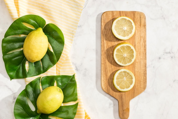 Juicy lemons on wooden board