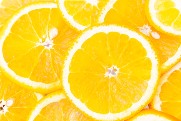 Juicy orange slices top view background