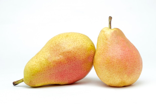 Juicy pears on a white surface