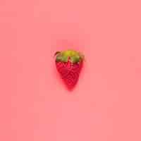 Free photo juicy red strawberry on pink background