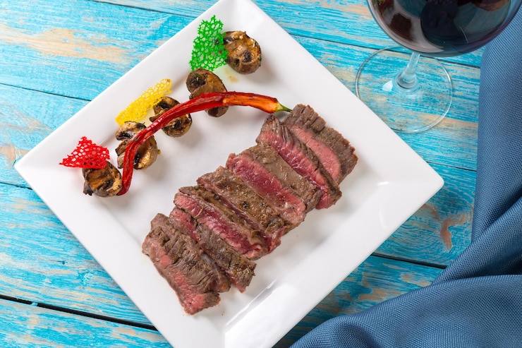 Free Photo juicy steak medium rare beef with spices and grilled vegetables