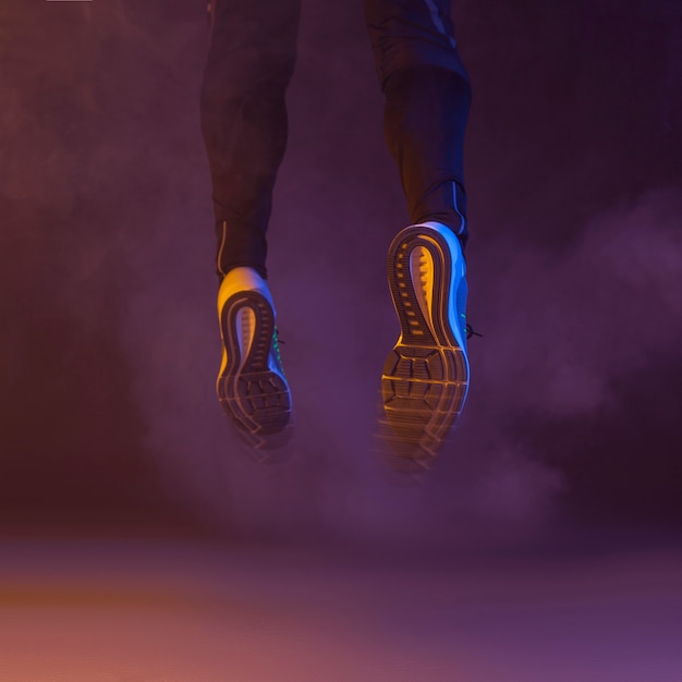 Free photo jumping legs in smoke