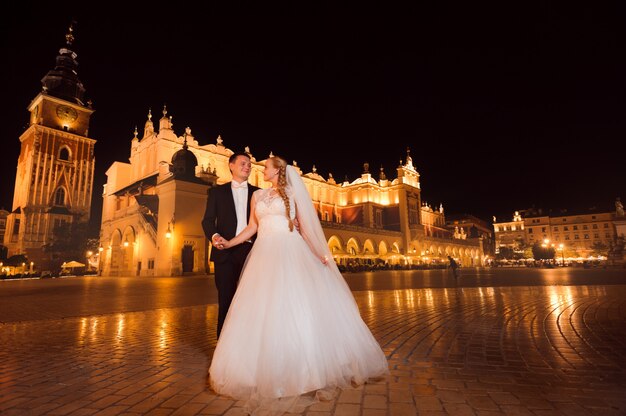 Just married couple night city walk