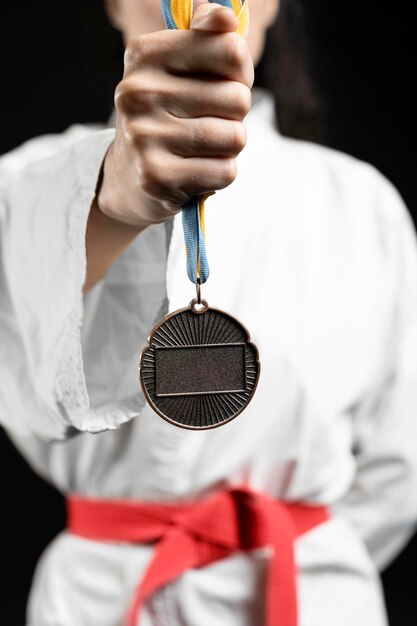 Karate athlete holding medal