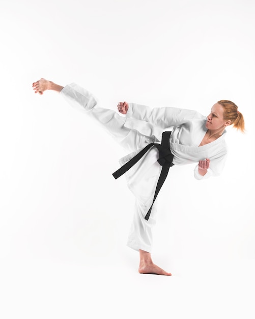 Karate fighter doing side kick