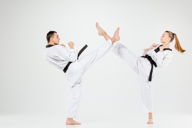 The karate girl and boy with black belts