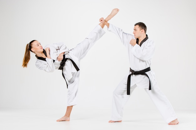 The karate girl and boy with black belts