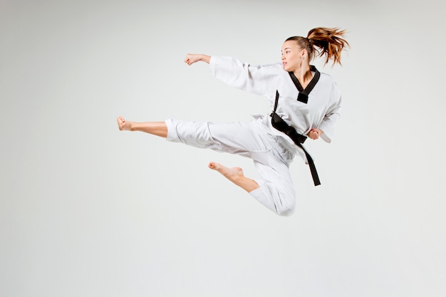 Free photo the karate girl with black belt