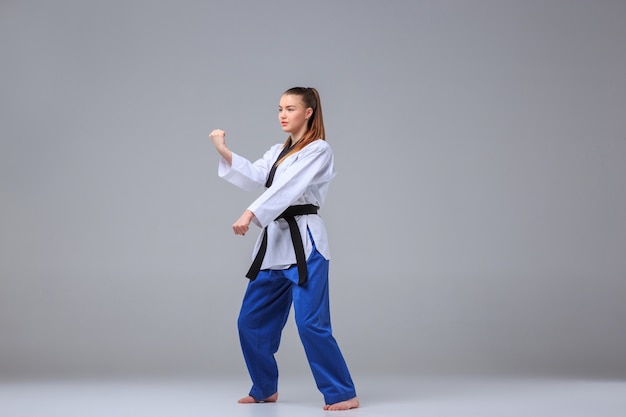 Free photo the karate girl with black belt