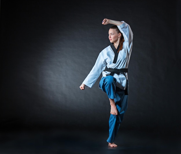 Free photo the karate girl with black belt