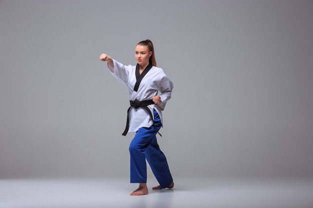 Free photo the karate girl with black belt