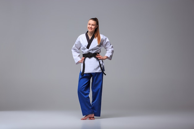 Free photo the karate girl with black belt