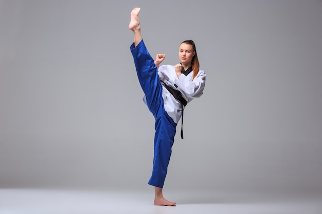 Free photo the karate girl with black belt