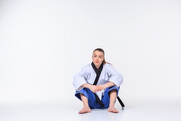 Free photo the karate girl with black belt