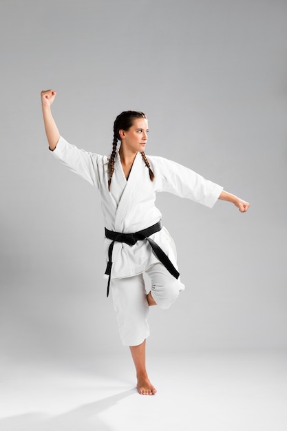 Free photo karate woman in action isolated in white background