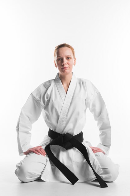 Karate woman sitting front view