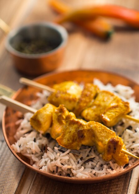 Kebab and rice on pan