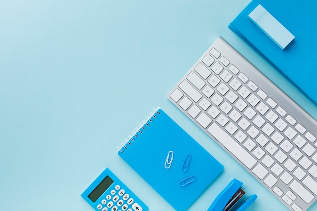 Keyboard and notepad flat lay