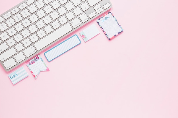 Keyboard with cute notes on desktop
