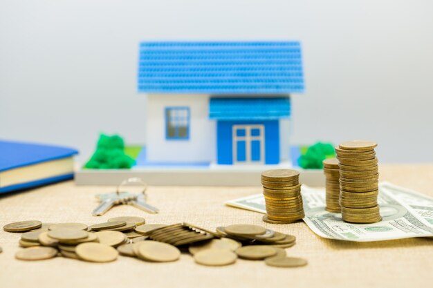 keys, house and money pile 