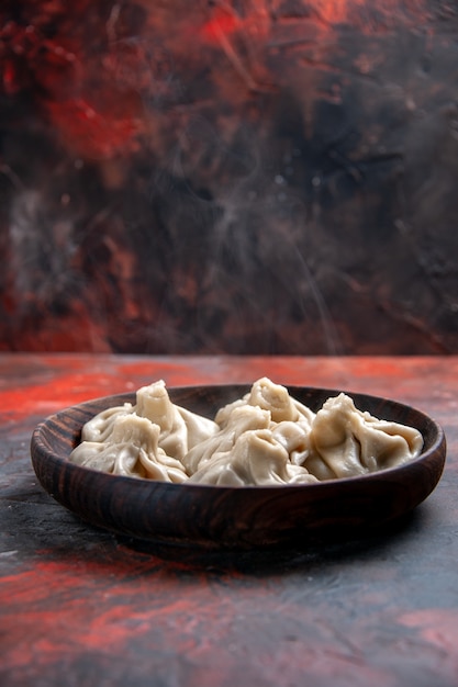 Free photo khinkali wooden bowl of khinkali