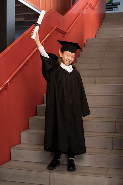 Free photo kid celebrating kindergarten graduation