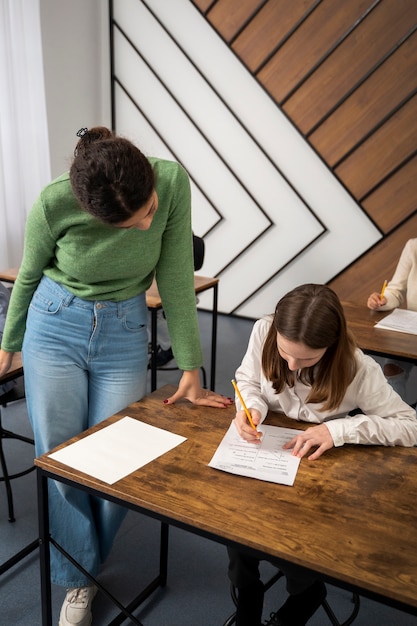 Free photo kid cheating at school high angle