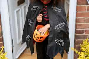 Free photo kid in cute but scary devil costume