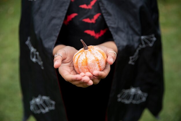 Kid in cute but scary devil costume