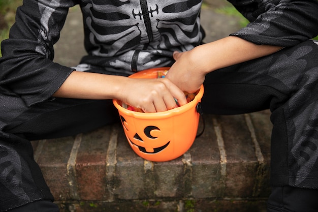 Kid in cute but scary skeleton costume