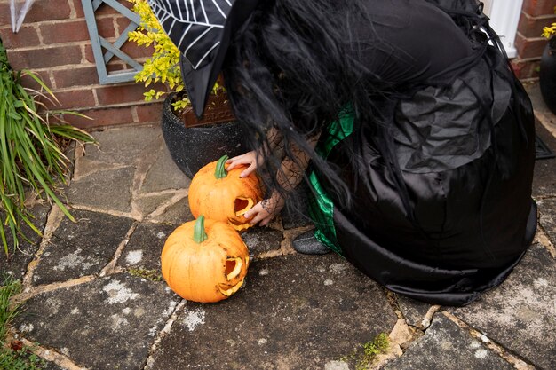 Kid in cute but scary witch costume