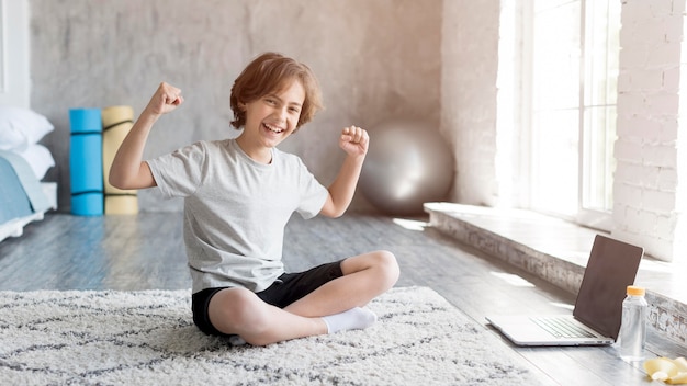 Kid doing sport at home