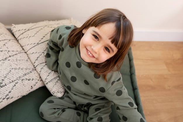 Free photo kid having fun in her room