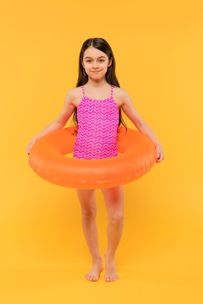 Free photo kid having fun in a summer setting studio