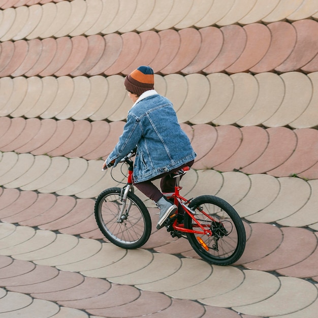 Kid having fun with bike outdoors