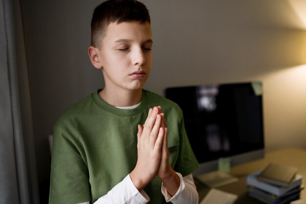 Kid meditating and focusing