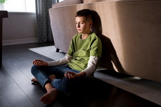 Kid meditating and focusing