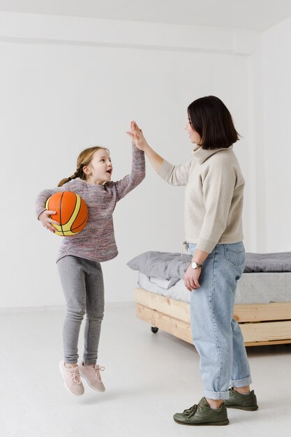 Kid and mom making high five